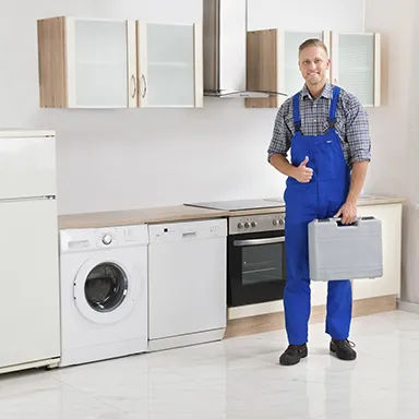 Technician repairing a home appliance, showcasing the benefits of repair services.