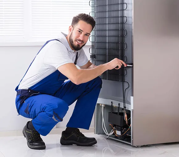 Skilled technicians providing refrigerator repair services to restore optimal performance.